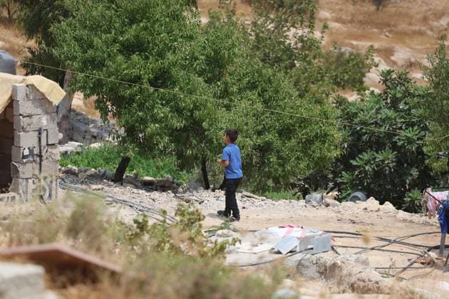 August 16, 2026, Masafer Yatta, Palestine, State of: MASAFER YATTA, WEST BANK, PALESTINE, AUGUST 16, 2026: Palestinian Abdullah Dababseh holds his phone displaying a demolition order issued by the Israeli army for the cave where he lives in Khirbet Khallet Al-Dabaa, south of Hebron. According to local residents, demolition orders were issued for three homes, three caves, a school, trees and crops in the area. Residents said the village was demolished in May 2025, forcing some Palestinians to live in caves. Masafer Yatta Palestine, State of - ZUMAq101 20260816_zna_q101_094 Copyright: xMosabxShawerx