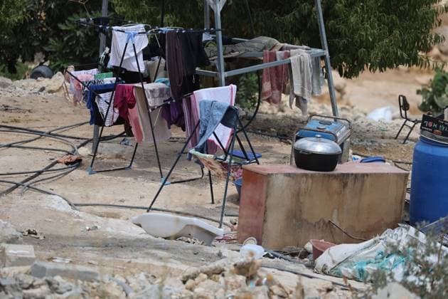 August 16, 2026, Masafer Yatta, Palestine, State of: MASAFER YATTA, WEST BANK, PALESTINE, AUGUST 16, 2026: Palestinian Abdullah Dababseh holds his phone displaying a demolition order issued by the Israeli army for the cave where he lives in Khirbet Khallet Al-Dabaa, south of Hebron. According to local residents, demolition orders were issued for three homes, three caves, a school, trees and crops in the area. Residents said the village was demolished in May 2025, forcing some Palestinians to live in caves. Masafer Yatta Palestine, State of - ZUMAq101 20260816_zna_q101_100 Copyright: xMosabxShawerx