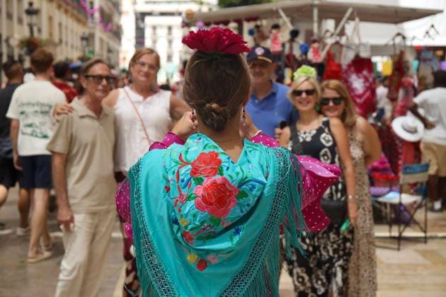 Scene at the 2026 Málaga Fair: Several women, dressed in traditional flamenco dresses, stroll through the Málaga Historic Center Fair. August 17, 2026, in Málaga, Andalusia, Spain. The capital of the Costa del Sol celebrates its big week, during which residents and visitors gather to enjoy the festive atmosphere and the numerous activities offered by the Feria. August 17, 2026, in Málaga, Andalusia, Spain Málaga, Andalusia, Spain Spain Copyright: xÃlexxZeax 7718769