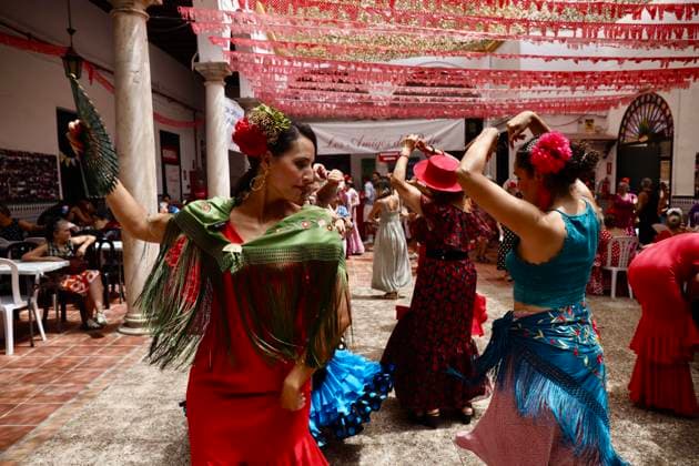 Scene at the 2026 Málaga Fair: Several women, dressed in traditional flamenco outfits, stroll through the Cortijo de Torres grounds during the Málaga Fair. August 17, 2026, in Málaga, Andalusia, Spain. The capital of the Costa del Sol celebrates its big week, during which locals and visitors gather to enjoy the festive atmosphere and the many activities the Feria has to offer. August 17, 2026, in Málaga, Andalusia, Spain Málaga, Andalusia, Spain Spain Copyright: xÃlexxZeax 7718776