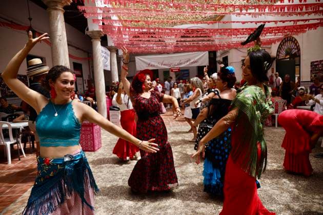 Scene at the 2026 Málaga Fair: Several women, dressed in traditional flamenco outfits, stroll through the Cortijo de Torres grounds during the Málaga Fair. August 17, 2026, in Málaga, Andalusia, Spain. The capital of the Costa del Sol celebrates its big week, during which locals and visitors gather to enjoy the festive atmosphere and the many activities the Feria has to offer. August 17, 2026, in Málaga, Andalusia, Spain Málaga, Andalusia, Spain Spain Copyright: xÃlexxZeax 7718777