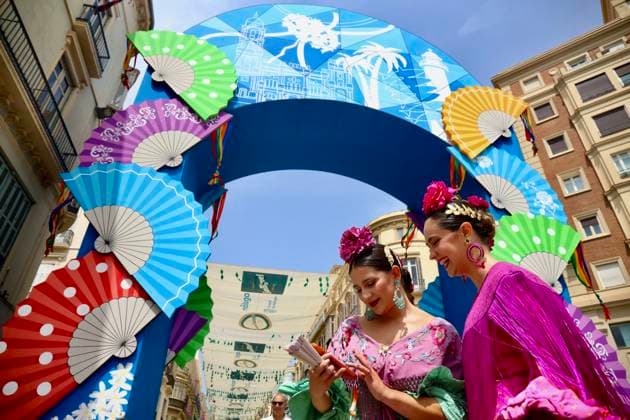 Scene at the 2026 Málaga Fair: Several women, dressed in traditional flamenco dresses, stroll through the Cortijo de Torres grounds during the Málaga Fair. August 17, 2026, in Málaga, Andalusia, Spain. The capital of the Costa del Sol celebrates its big week, during which locals and visitors gather to enjoy the festive atmosphere and the many activities offered by the Feria. August 17, 2026, in Málaga, Andalusia, Spain Málaga, Andalusia, Spain Spain Copyright: xÃlexxZeax 7718780