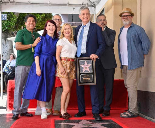 American screenwriter, television producer and director Greg Daniels (holding a replica plaque) is joined by actors Oscar Nunez, Kate Flannery, Paul Lieberstein, Angela Kinsey, Steve Carell, and Rainn Wilson (L-R) during an unveiling ceremony honoring Daniels with the 2,856th star on the Hollywood Walk of Fame in Los Angeles on Thursday, September 10, 2026.  LAP2026091005 JIMxRUYMEN