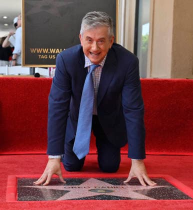 American screenwriter, television producer and director Greg Daniels touches his star during an unveiling ceremony honoring Daniels with the 2,856th star on the Hollywood Walk of Fame in Los Angeles on Thursday, September 10, 2026.  LAP2026091011 JIMxRUYMEN