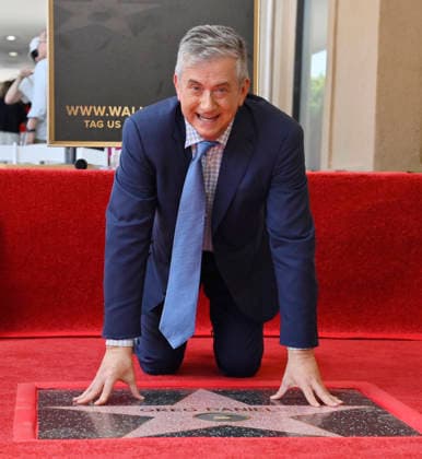 American screenwriter, television producer and director Greg Daniels touches his star during an unveiling ceremony honoring Daniels with the 2,856th star on the Hollywood Walk of Fame in Los Angeles on Thursday, September 10, 2026.  LAP2026091011 JIMxRUYMEN