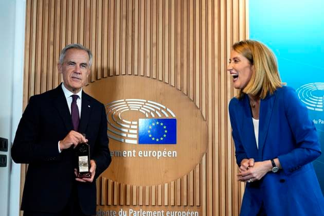 September 16, 2026, Strasbourg, France: President of the European Parliament Roberta Metsola laughs as Prime Minister Mark Carney jokes with her while presenting her with a bottle of maple syrup labelled with his name and title, as they exchange gifts during a bilateral meeting at the European Parliament in Strasbourg, France, on Wednesday, Sept. 16, 2026. Strasbourg France  - ZUMAc35_ 20260916_zaf_c35_047 Copyright: xJustinxTangx