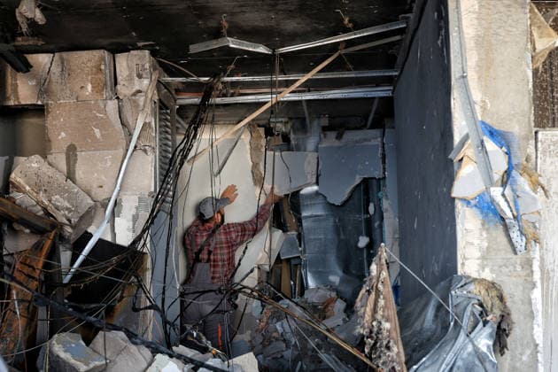 Overnight Russian Attack Damages 19-Storey Apartment Block - Odesa A worker removes unsafe internal partitions inside an apartment destroyed by a nighttime Russian drone strike on a 19-storey block of flats in Odesa, Ukraine, September 17, 2026. Ten apartments between the 14th and 16th floors sustained significant damage. Three people, including a four-year-old child, were injured. Photo by Nina Liashonok Ukrinform ABACAPRESS.COM Odesa Ukraine  Copyright: xLyashonokxNina Ukrinform ABACAx