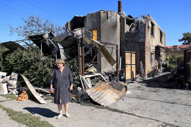 Private House Destroyed by Russian Attack - Odesa A woman stands outside a private house destroyed by a massive overnight Russian drone strike in a residential area of the Peresypskyi district, Odesa, Ukraine, September 17, 2026. The blast wave and debris destroyed one private house, while at least four neighbouring properties sustained significant damage, with roofs wrecked, windows shattered, and walls scarred by shrapnel. Falling debris also ignited outbuildings, garages, and several nearby parked cars. Civilians, including children, were injured in the attack. Photo by Nina Liashonok Ukrinform ABACAPRESS.COM Odesa Ukraine  Copyright: xLyashonokxNina Ukrinform ABACAx
