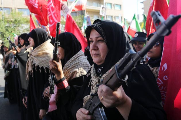 Armed volunteers march through central Tehran in Basij-led mobilization rally TEHRAN, IRAN - SEPTEMBER 18: (RESTRICTIONS: No Access Israel Media Persian Language TV Stations Outside Iran Strictly No Access BBC Persian VOA Persian Manoto TV Iran International TV) Armed volunteers registered with the Janfada-ye Iran program march between Imam Hossein Square and Enqelab Square in Tehran, Iran on September 18, 2026. Led by the Basij paramilitary force affiliated with the Islamic Revolutionary Guard Corps (IRGC), demonstrators carrying automatic rifles and long-barrel weapons took to the streets to demonstrate wartime mobilization and national defense readiness following recent US and Israeli strikes. Fatemeh Bahrami Anadolu Tehran Iran. Ed  Copyright: x2026xAnadoluxFatemehxBahramix