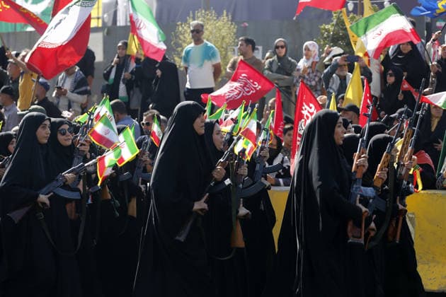 Armed volunteers march through central Tehran in Basij-led mobilization rally TEHRAN, IRAN - SEPTEMBER 18: (RESTRICTIONS: No Access Israel Media Persian Language TV Stations Outside Iran Strictly No Access BBC Persian VOA Persian Manoto TV Iran International TV) Armed volunteers registered with the Janfada-ye Iran program march between Imam Hossein Square and Enqelab Square in Tehran, Iran on September 18, 2026. Led by the Basij paramilitary force affiliated with the Islamic Revolutionary Guard Corps (IRGC), demonstrators carrying automatic rifles and long-barrel weapons took to the streets to demonstrate wartime mobilization and national defense readiness following recent US and Israeli strikes. Fatemeh Bahrami Anadolu Tehran Iran. Ed  Copyright: x2026xAnadoluxFatemehxBahramix