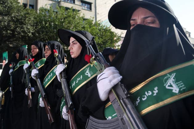 Armed volunteers march through central Tehran in Basij-led mobilization rally TEHRAN, IRAN - SEPTEMBER 18: (RESTRICTIONS: No Access Israel Media Persian Language TV Stations Outside Iran Strictly No Access BBC Persian VOA Persian Manoto TV Iran International TV) Armed volunteers registered with the Janfada-ye Iran program march between Imam Hossein Square and Enqelab Square in Tehran, Iran on September 18, 2026. Led by the Basij paramilitary force affiliated with the Islamic Revolutionary Guard Corps (IRGC), demonstrators carrying automatic rifles and long-barrel weapons took to the streets to demonstrate wartime mobilization and national defense readiness following recent US and Israeli strikes. Fatemeh Bahrami Anadolu Tehran Iran. Ed  Copyright: x2026xAnadoluxFatemehxBahramix