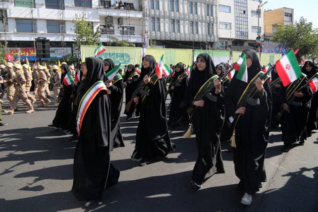 Armed volunteers march through central Tehran in Basij-led mobilization rally TEHRAN, IRAN - SEPTEMBER 18: (RESTRICTIONS: No Access Israel Media Persian Language TV Stations Outside Iran Strictly No Access BBC Persian VOA Persian Manoto TV Iran International TV) Armed volunteers registered with the Janfada-ye Iran program march between Imam Hossein Square and Enqelab Square in Tehran, Iran on September 18, 2026. Led by the Basij paramilitary force affiliated with the Islamic Revolutionary Guard Corps (IRGC), demonstrators carrying automatic rifles and long-barrel weapons took to the streets to demonstrate wartime mobilization and national defense readiness following recent US and Israeli strikes. Fatemeh Bahrami Anadolu Tehran Iran. Ed  Copyright: x2026xAnadoluxFatemehxBahramix