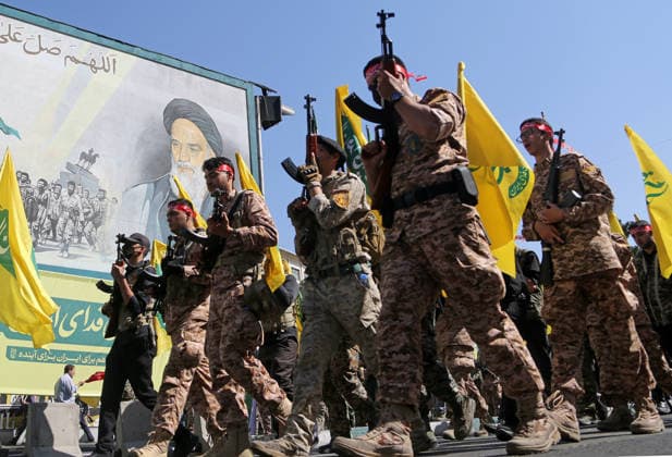 Armed volunteers march through central Tehran in Basij-led mobilization rally TEHRAN, IRAN - SEPTEMBER 18: (RESTRICTIONS: No Access Israel Media Persian Language TV Stations Outside Iran Strictly No Access BBC Persian VOA Persian Manoto TV Iran International TV) Armed volunteers registered with the Janfada-ye Iran program march between Imam Hossein Square and Enqelab Square in Tehran, Iran on September 18, 2026. Led by the Basij paramilitary force affiliated with the Islamic Revolutionary Guard Corps (IRGC), demonstrators carrying automatic rifles and long-barrel weapons took to the streets to demonstrate wartime mobilization and national defense readiness following recent US and Israeli strikes. Fatemeh Bahrami Anadolu Tehran Iran. Ed  Copyright: x2026xAnadoluxFatemehxBahramix