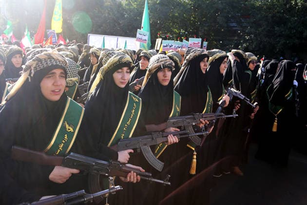 Armed volunteers march through central Tehran in Basij-led mobilization rally TEHRAN, IRAN - SEPTEMBER 18: (RESTRICTIONS: No Access Israel Media Persian Language TV Stations Outside Iran Strictly No Access BBC Persian VOA Persian Manoto TV Iran International TV) Armed volunteers registered with the Janfada-ye Iran program march between Imam Hossein Square and Enqelab Square in Tehran, Iran on September 18, 2026. Led by the Basij paramilitary force affiliated with the Islamic Revolutionary Guard Corps (IRGC), demonstrators carrying automatic rifles and long-barrel weapons took to the streets to demonstrate wartime mobilization and national defense readiness following recent US and Israeli strikes. Fatemeh Bahrami Anadolu Tehran Iran. Ed  Copyright: x2026xAnadoluxFatemehxBahramix
