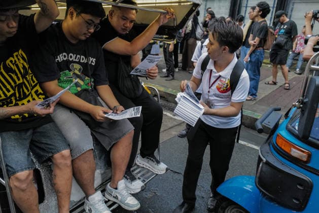 September 18, 2026, Philippines: A student giving pamphlets to commuters during the Black Friday Protest on Friday at Taft Ave, Metro Manila. It coincided with the Black Friday Protests from different universities and a preparation for the mass movement on Sept. 21 for the Martial Law anniversary. Among the calls were for the alleged human rights abuses, corruption, and the Pax Silica initiative under the administration of President Ferdinand Marcos Jr. Philippines  - ZUMAr240 20260918_zip_r240_031 Copyright: xMarcxDominicxRostratax