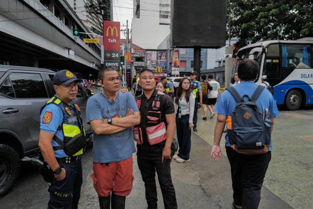 September 18, 2026, Philippines: La Salle securities and police talk with each other during the Black Friday Protest on Friday at Taft Ave, Metro Manila. It coincided with the Black Friday Protests from different universities and a preparation for the mass movement on Sept. 21 for the Martial Law anniversary. Among the calls were for the alleged human rights abuses, corruption, and the Pax Silica initiative under the administration of President Ferdinand Marcos Jr. Philippines - ZUMAr240 20260918_zip_r240_021 Copyright: xMarcxDominicxRostratax