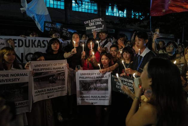 September 18, 2026, Philippines: Students from La Salle along with One Taft, a coalition of Taft-based schools, light candles to end the program of the Black Friday Protest on Friday at Taft Ave, Metro Manila. It coincided with the Black Friday Protests from different universities and a preparation for the mass movement on Sept. 21 for the Martial Law anniversary. Among the calls were for the alleged human rights abuses, corruption, and the Pax Silica initiative under the administration of President Ferdinand Marcos Jr. Philippines - ZUMAr240 20260918_zip_r240_047 Copyright: xMarcxDominicxRostratax
