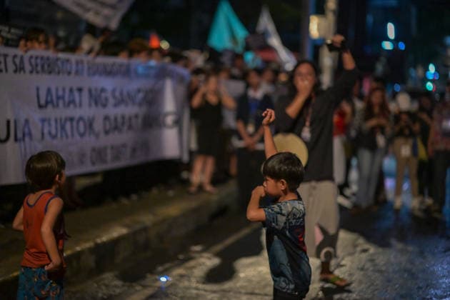 September 18, 2026, Philippines: A kid imitating the lifting of the fist by the speaker during the Black Friday Protest on Friday at Taft Ave, Metro Manila. It coincided with the Black Friday Protests from different universities and a preparation for the mass movement on Sept. 21 for the Martial Law anniversary. Among the calls were for the alleged human rights abuses, corruption, and the Pax Silica initiative under the administration of President Ferdinand Marcos Jr. Philippines - ZUMAr240 20260918_zip_r240_003 Copyright: xMarcxDominicxRostratax
