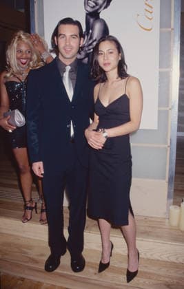 **FILE PHOTO** Duncan Sheik Has Passed Away. Duncan Sheik and China Chow attend Cartier s Trinity Ring s 75th Anniversary Celebration at Obeca Li in New York City on May 11, 1998. Lil™ Kim is seen behind Sheik and Chow. Photo Copyright: xHenryxMcGee MediaPunchx