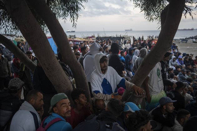 Migrants relocated from Ceuta beaches in Spain CEUTA, SPAIN - SEPTEMBER 18: Police officers contain migrants during a transfer operation from Trampolin and Benitez beaches to new facilities at the Port of Ceuta in Ceuta, Spain, on September 18, 2026. Police transfer approximately 1,700 migrants amid heightened tensions marked by a stampede, police baton strikes, shots fired into the air and several injuries. Jose Colon Anadolu Ceuta Spain. Editorial use only. Please get in touch for any other usage.  Copyright: x2026xAnadoluxJosexColonx