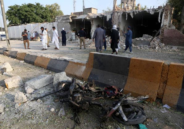 16 killed in suspected suicide bombing near police compound in NW Pakistan KHYBER PAKHTUNKWA, PAKISTAN - SEPTEMBER 18: People gather around a damaged mosque following a suicide bombing targeting a police compound in Kohat district of Khyber Pakhtunkhwa province, Pakistan, on September 18, 2026. At least 16 people, including 11 civilians and five police officers, were killed and over 50 others wounded in a suspected suicide bombing targeting a police compound in northwestern Pakistan during Friday congregational prayers, officials said. The casualties occurred when an explosives-laden vehicle rammed into the Old Police Lines gate in Kohat district of Khyber Pakhtunkhwa province, a senior police official said, according to local broadcaster G  Copyright: x2026xAnadoluxHussainxAlix