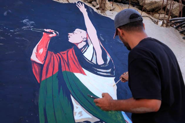 Palestinian Artists Paint Macklemore Mural in Gaza City Palestinian artists paint a mural of American rapper Macklemore on the wall of a building destroyed during the war in Gaza City, in the Gaza Strip, on September 17, 2026. The mural depicts Macklemore performing alongside messages thanking him for using his voice to support Palestinians and highlight the situation of civilians in Gaza. Macklemore released Hind’s Hall in 2024 and said proceeds from the song would be donated to UNRWA.Photo by Abdullah Abu Al-Khair apaimages Gaza Gaza Strip Palestinian Territory 180926_Gaza_AKH_00(8) Copyright: xapaimagesxAbdullahxAbuxAl-Khair xapaimagesx