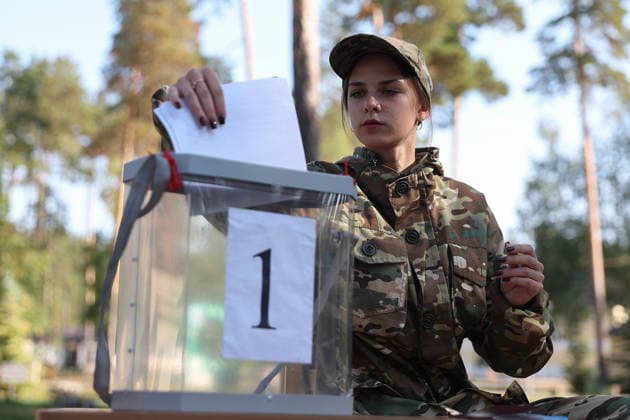 RUSSIA, PENZA - SEPTEMBER 19, 2026: A woman casts her vote at a mobile ballot box at the Meridian sports and health camp during the 2026 Russian legislative election held on September 18-20, including regional parliamentary and local elections, as well as the election to the Russian State Duma of the 9th convocation. Yegor Aleyev TASS  97941056
