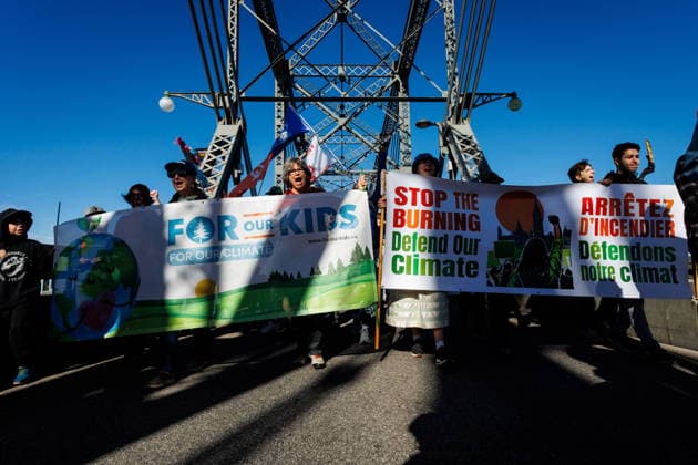 September 19, 2026, Ottawa, On, Canada: Demonstrators march across the Alexandra Bridge during a climate march in Ottawa, on Saturday, Sept. 19, 2026. Ottawa Canada  - ZUMAc35_ 20260919_zaf_c35_016 Copyright: xKeitoxNewmanx