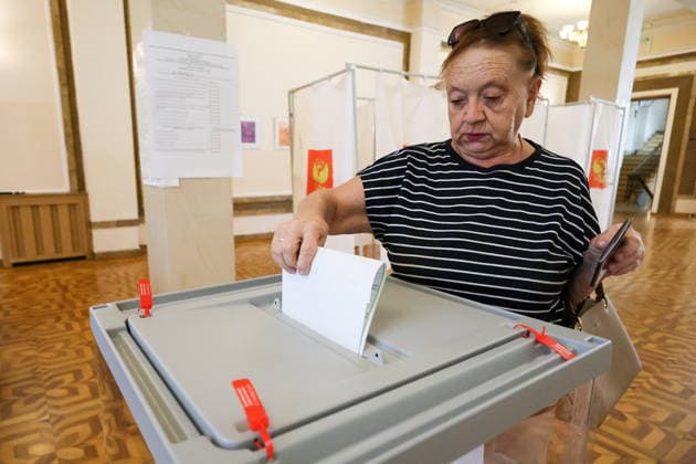 RUSSIA, SEVASTOPOL - SEPTEMBER 20, 2026: A woman casts her vote at the Centre of Culture and Arts on Lenin Street during the 2026 Russian legislative election held on September 18 to 20 and including regional parliamentary and local elections as well as the election to the Russian State Duma of the 9th convocation. Sergei Malgavko TASS  98015537