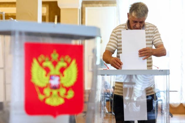 RUSSIA, SEVASTOPOL - SEPTEMBER 20, 2026: Aman casts his vote at the Centre of Culture and Arts on Lenin Street during the 2026 Russian legislative election held on September 18 to 20 and including regional parliamentary and local elections as well as the election to the Russian State Duma of the 9th convocation. Sergei Malgavko TASS  98015544