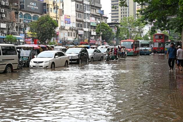September 20, 2026, Dhaka, Bangladesh: DHAKA, BANGLADESH, SEPTEMBER 20, 2026: Vehicles and passengers navigate waterlogged streets in Dhaka following heavy rainfall in the Bangladeshi capital. Floodwater submerged sections of roads across the city, disrupting traffic and making travel difficult for residents and commuters. Dhaka Bangladesh - ZUMAq101 20260920_zna_q101_071 Copyright: xMamunurxRashidx
