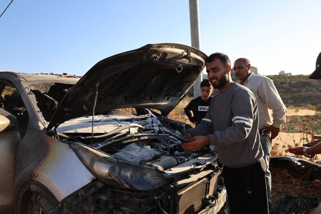 September 20, 2026, Hebron, Palestine, State of: BEIT UMMAR, HEBRON, OCCUPIED WEST BANK, SEPTEMBER 20, 2026: Burned vehicles are seen following an attack by Israeli settlers in the town of Beit Ummar, north of Hebron. According to local sources, a Palestinian woman was injured and five vehicles were set on fire during the attack. Hebron Palestine, State of - ZUMAq101 20260920_zna_q101_082 Copyright: xMosabxShawerx