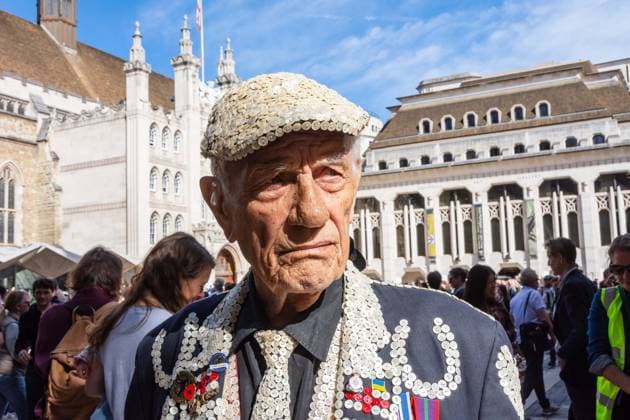 September 20, 2026, London, London, England: Pearly Kings and QueenÃ¢â‚¬â ¢s of London gather with city Mayors, Chelsea pensioner war veterans and dignitaries at Guildhall Yard for the annual Costermongers Harvest Festival celebration. Morris dancers and choirs performed along with the Pearly Kings and Queens who led a sing-a-long of traditional favourite songs such as: Ã¢â‚¬ËœKnees up Mother BrownÃ¢â‚¬â ¢ and Ã¢â‚¬ËœDoing the Lambeth walkÃ¢â‚¬â ¢. A procession followed to the spiritual home of LondonÃ¢â‚¬â ¢s Ã¢â‚¬ËœEastendersÃ¢â‚¬â ¢ at St Mary-le-Bow Church. Tradition has it that anyone born within earshot of the Bow Bells can claim to be a true Cockney. The march was led by a pearly prince carrying a plaited loaf of bread that was prese - ZUMAr169 20260920_zip_r169_007 Copyright: xRodxHarbinsonx