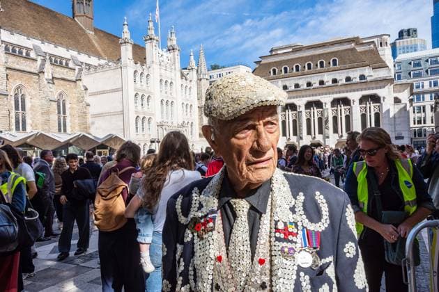 September 20, 2026, London, London, England: Pearly Kings and QueenÃ¢â‚¬â ¢s of London gather with city Mayors, Chelsea pensioner war veterans and dignitaries at Guildhall Yard for the annual Costermongers Harvest Festival celebration. Morris dancers and choirs performed along with the Pearly Kings and Queens who led a sing-a-long of traditional favourite songs such as: Ã¢â‚¬ËœKnees up Mother BrownÃ¢â‚¬â ¢ and Ã¢â‚¬ËœDoing the Lambeth walkÃ¢â‚¬â ¢. A procession followed to the spiritual home of LondonÃ¢â‚¬â ¢s Ã¢â‚¬ËœEastendersÃ¢â‚¬â ¢ at St Mary-le-Bow Church. Tradition has it that anyone born within earshot of the Bow Bells can claim to be a true Cockney. The march was led by a pearly prince carrying a plaited loaf of bread that was prese - ZUMAr169 20260920_zip_r169_008 Copyright: xRodxHarbinsonx