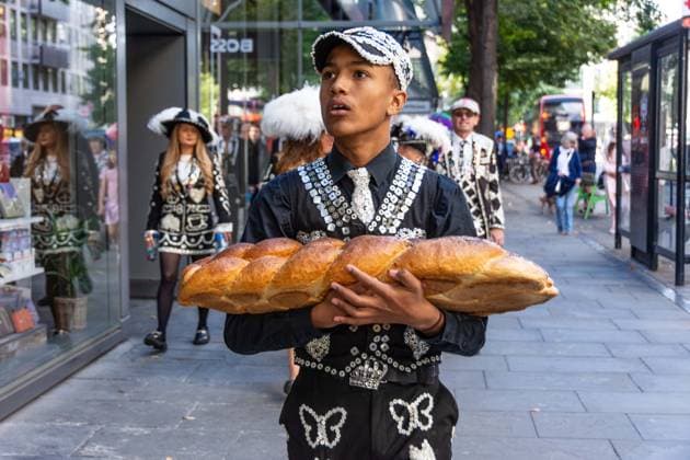 September 20, 2026, London, London, England: Pearly Kings and QueenÃ¢â‚¬â ¢s of London gather with city Mayors, Chelsea pensioner war veterans and dignitaries at Guildhall Yard for the annual Costermongers Harvest Festival celebration. Morris dancers and choirs performed along with the Pearly Kings and Queens who led a sing-a-long of traditional favourite songs such as: Ã¢â‚¬ËœKnees up Mother BrownÃ¢â‚¬â ¢ and Ã¢â‚¬ËœDoing the Lambeth walkÃ¢â‚¬â ¢. A procession followed to the spiritual home of LondonÃ¢â‚¬â ¢s Ã¢â‚¬ËœEastendersÃ¢â‚¬â ¢ at St Mary-le-Bow Church. Tradition has it that anyone born within earshot of the Bow Bells can claim to be a true Cockney. The march was led by a pearly prince carrying a plaited loaf of bread that was prese - ZUMAr169 20260920_zip_r169_018 Copyright: xRodxHarbinsonx