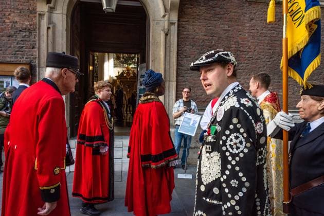 September 20, 2026, London, London, England: Pearly Kings and QueenÃ¢â‚¬â ¢s of London gather with city Mayors, Chelsea pensioner war veterans and dignitaries at Guildhall Yard for the annual Costermongers Harvest Festival celebration. Morris dancers and choirs performed along with the Pearly Kings and Queens who led a sing-a-long of traditional favourite songs such as: Ã¢â‚¬ËœKnees up Mother BrownÃ¢â‚¬â ¢ and Ã¢â‚¬ËœDoing the Lambeth walkÃ¢â‚¬â ¢. A procession followed to the spiritual home of LondonÃ¢â‚¬â ¢s Ã¢â‚¬ËœEastendersÃ¢â‚¬â ¢ at St Mary-le-Bow Church. Tradition has it that anyone born within earshot of the Bow Bells can claim to be a true Cockney. The march was led by a pearly prince carrying a plaited loaf of bread that was prese - ZUMAr169 20260920_zip_r169_026 Copyright: xRodxHarbinsonx