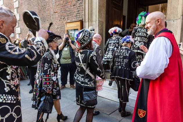 September 20, 2026, London, London, England: Pearly Kings and QueenÃ¢â‚¬â ¢s of London gather with city Mayors, Chelsea pensioner war veterans and dignitaries at Guildhall Yard for the annual Costermongers Harvest Festival celebration. Morris dancers and choirs performed along with the Pearly Kings and Queens who led a sing-a-long of traditional favourite songs such as: Ã¢â‚¬ËœKnees up Mother BrownÃ¢â‚¬â ¢ and Ã¢â‚¬ËœDoing the Lambeth walkÃ¢â‚¬â ¢. A procession followed to the spiritual home of LondonÃ¢â‚¬â ¢s Ã¢â‚¬ËœEastendersÃ¢â‚¬â ¢ at St Mary-le-Bow Church. Tradition has it that anyone born within earshot of the Bow Bells can claim to be a true Cockney. The march was led by a pearly prince carrying a plaited loaf of bread that was prese  - ZUMAr169 20260920_zip_r169_043 Copyright: xRodxHarbinsonx