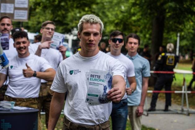 September 20, 2026, Munich, Bavaria, Germany: Coinciding with Oktoberfest, a group of right-extremists from the Identitaere Bewegung held a rally under the Banner of the Save Europe Act which includes, according to them, guidelines for the so-called Remigration. Some members discussed Remigration to include non-native born Germans, as they feel they can never be German, even if they hit all integration points. Critics in Germany see it as eyebrow-raising that the Identitaere leader, Martin Sellner, is an Austrian that is essentially making German policy and can play a greater role in government should the AfD take power. Munich Germany - ZUMAb160 20260920_abp_b160_009 Copyright: xSachellexBabbarx