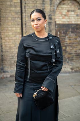 September 20, 2026, London, Camden, United Kingdom: An attendee arrives wearing a black dress at the Erdem catwalk show, held at the Roundhouse in Camden, London, as part of London Fashion Week 2026. Models and members of the fashion industry gather at the Roundhouse in Camden, London, for the Erdem catwalk show during London Fashion Week 2026. The event forms part of the official London Fashion Week schedule, bringing together models, designers, fashion professionals, media and guests for the presentation of Erdem s latest collection. London United Kingdom - ZUMAs197 20260920_aaa_s197_358 Copyright: xJamesxWilloughbyx
