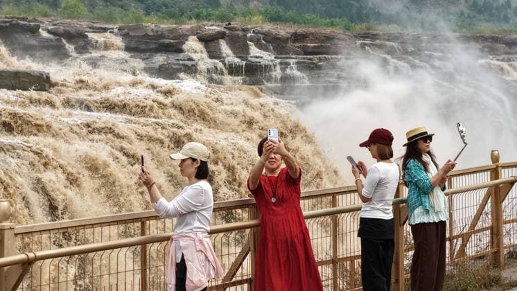 YAN AN, CHINA - SEPTEMBER 20: The water volume of the Hukou Waterfall on the Yellow River increases significantly due to sediment flushing and flood discharge from upstream reservoirs on September 20, 2026 in Yan an, Shaanxi Province of China. The flow rate reached 1,800 cubic meters per second, merging the main and side waterfalls into a continuous line and attracting tourists to view the spectacle.  Copyright: xVCGx 111668265447