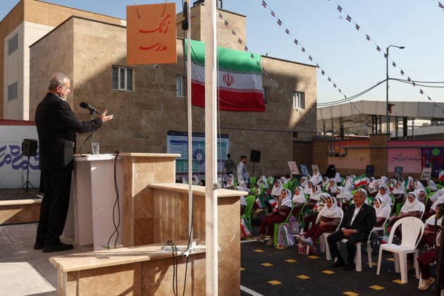September 21, 2026, Tehran, Iran: Iranian President Masoud Pezeshkian addresses seated pupils from an outdoor podium during a school-year opening ceremony at Fatemeh Zahra Girls Primary School in Tehran, Iran, on September 21, 2026. The ceremony, known as Jashn-e Shokoufeha, or the Festival of Blossoms, marks the start of school for first-grade pupils across Iran. Iranian state media said about 1.154 million first-grade students were beginning school nationwide this year. Tehran Iran - ZUMAi98_ 20260921_zih_i98_002 Copyright: xIranianxPresidencyx