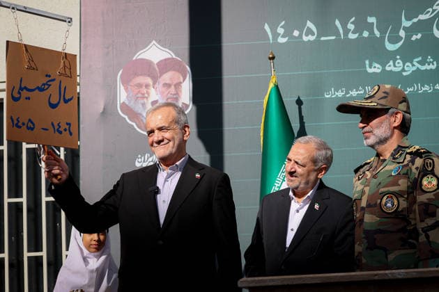 September 21, 2026, Tehran, Iran: Iranian President Masoud Pezeshkian holds the school bell marker beside senior officials during the opening of the new school year at Fatemeh Zahra Girls Primary School in Tehran, Iran, on September 21, 2026. The ceremony, known as Jashn-e Shokoufeha, or the Festival of Blossoms, marks the start of school for first-grade pupils across Iran. Iranian state media said about 1.154 million first-grade students were beginning school nationwide this year. Tehran Iran - ZUMAi98_ 20260921_zih_i98_013 Copyright: xIranianxPresidencyx