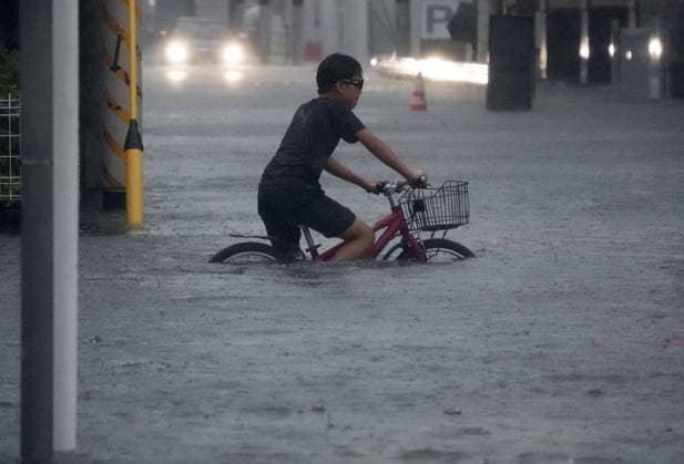 Typhoon in eastern Japan A street in Ichikawa near Tokyo is flooded on Sept. 21, 2026, due to Typhoon Dujuan.  A14AA0005628193P