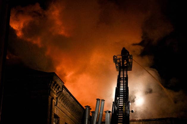 Historic Building of Zaporizhzhia National University Struck by Russian Army - Ukraine A rescuer uses an aerial work platform to extinguish a fire at Academic Building No. 3 of Zaporizhzhia National University, caused by an overnight Russian drone attack in the Oleksandrivskyi district of Zaporizhzhia, Ukraine, September 21, 2026. The building, a cultural heritage site and architectural monument of local significance, was formerly the Oleksandrivsk Girls? Gymnasium, built in 1902. A significant portion of the historic structure burned down in the attack. Buildings No. 4 and No. 5 also sustained damage, with windows shattered. The Russian strike additionally destroyed a shopping centre and damaged multi-storey residential blocks. Six people  Copyright: xSmoliyenkoxDmytro Ukrinform ABACAx