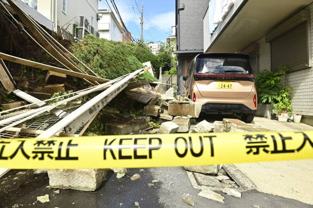 Typhoon Dujuan causes landslide damage in Tokyo TOKYO, JAPAN - SEPTEMBER 22 : Police tape restricts access to a narrow residential street where a retaining wall collapsed following heavy rain brought by Typhoon Dujuan in the Naka-Meguro area of Tokyo, Japan, September 22, 2026. A vehicle damaged by debris is seen behind the restricted area. David Mareuil Anadolu Tokyo Japan. Editorial use only. Please get in touch for any other usage.  Copyright: x2026xAnadoluxDavidxMareuilx