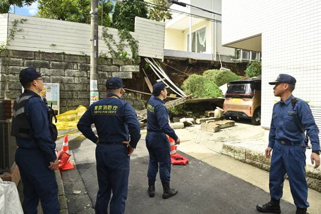 Typhoon Dujuan causes landslide damage in Tokyo TOKYO, JAPAN - SEPTEMBER 22 : Tokyo Fire Department personnel inspect the area around a collapsed residential retaining wall following heavy rain brought by Typhoon Dujuan in the Naka-Meguro area of Tokyo, Japan, September 22, 2026. Debris from the collapse blocked the narrow residential street. David Mareuil Anadolu Tokyo Japan. Editorial use only. Please get in touch for any other usage.  Copyright: x2026xAnadoluxDavidxMareuilx