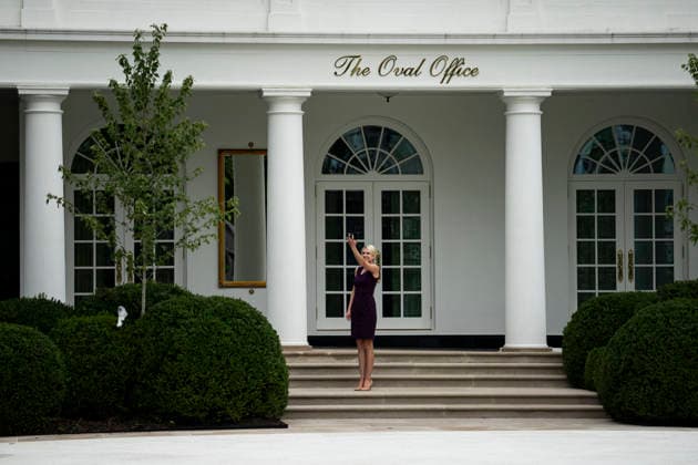 Natalie Harp, executive assistant to US President Donald Trump, films Marine One arriving on the new helipad on the South Lawn of the White House in Washington, DC on Monday, September 21, 2026. The new Marine One, a Sikorsky VH-92A Patriot, has an exhaust vent that could have scorched the White House grass.  WASP20260921108 AlxDrago