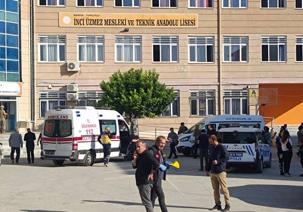(260922) -- MANISA, Sept. 22, 2026 -- An ambulance parks inside the high school where the shooting incident occurred nearby, in the Turgutlu district of Manisa, T¨¹rkiye, on Sept. 22, 2026. A teenage boy has been arrested and taken into custody after at least 11 people were injured in a shooting outside a high school in T¨¹rkiye s western province of Manisa on Tuesday morning, Justice Minister Akin Gurlek said. ( Handout via Xinhua) (SpotNews)T?RKIYE-MANISA-SCHOOL SHOOTING-INCIDENT MustafaxKaya 