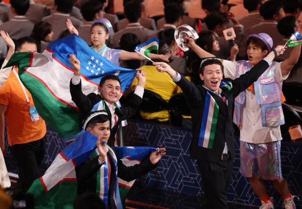 (260922) -- SHANGHAI, Sept. 22, 2026 -- Members of Uzbek delegation attend the opening ceremony of the 48th WorldSkills Competition in east China s Shanghai, Sept. 22, 2026. The 48th WorldSkills Competition opened in Shanghai on Tuesday evening, with 1,385 competitors from 68 countries and regions vying in 64 skill events. ) CHINA-SHANGHAI-WORLDSKILLS COMPETITION-OPENING CEREMONY (CN) JinxLiwang 