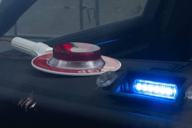 POLIZEI-Schriftzug, Polizeikelle und Blaulicht in einem Zivilfahrzeug der Polizei, Feature, Randmotiv, Symbolfoto, Messe EUDEX Euro Defence Expo, am 22.09.2026 in der Messe Essen Deutschland.
